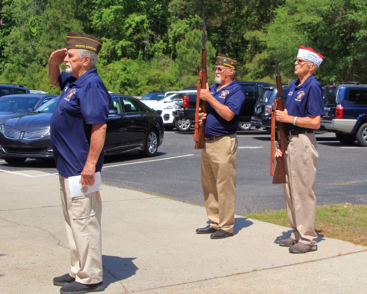 Calabash VFW Post 7288 members (L to R) Jay Bertha, Cliff Hinkley and Bill Hertline firing a salute in honor of fallen comrades.